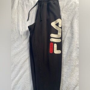 Black Fila sweatpants, tightens around ankles